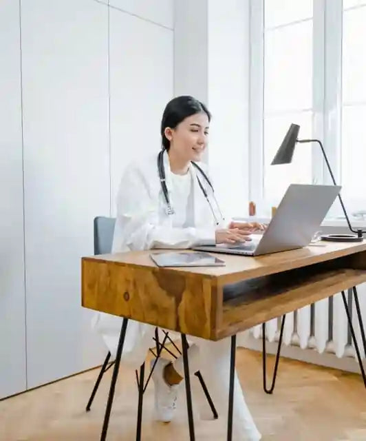 Veterinarian At Desk Working